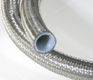 Click to enlarge - Convoluted PTFE overbraided hose offering superb flexibility and a very wide resistance to many chemicals, gases, fluids, etc. This new design offers all the advantages of a smooth bore with the flexibility of a convoluted hose.